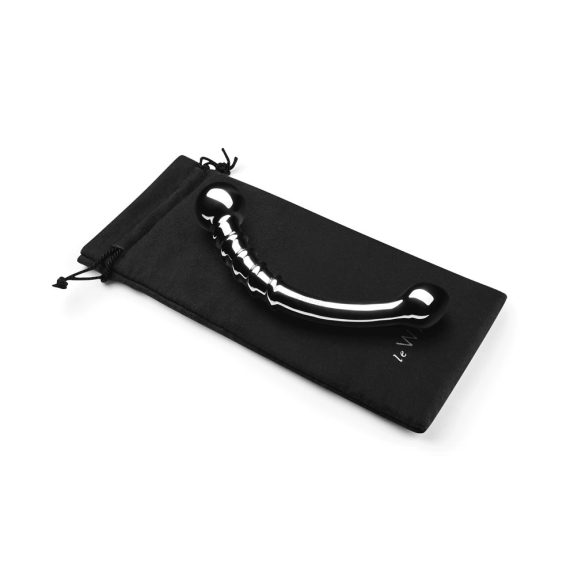 Curved stainless steel wand with a ridged section and bulbous ends, resting on a black pouch.