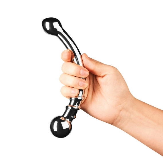 A hand holds a curved, silver stainless steel wand with a bulbous end.