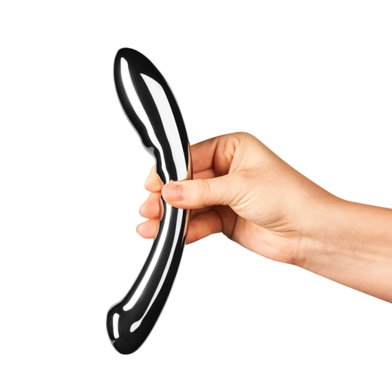 A hand holds a curved, double-ended stainless steel G-spot wand.