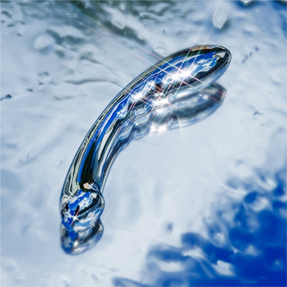 Curved stainless steel G-spot wand with a rippled bulbous end and a flattened tip.