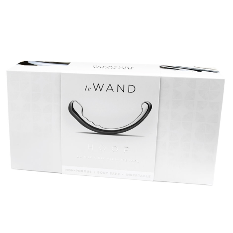 Stainless steel Le Wand Hoop with a curved design on its packaging.
