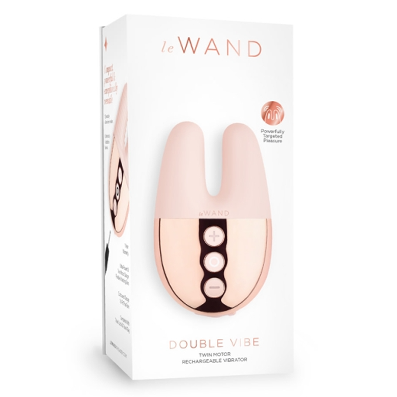 Rose gold Le Wand Double Vibe rechargeable vibrator with three control buttons.