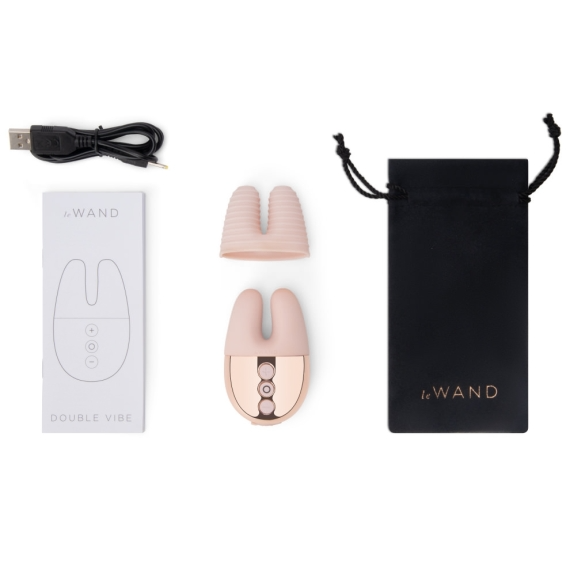 Rose gold rechargeable vibrator with charging cable, storage pouch, and instructions.