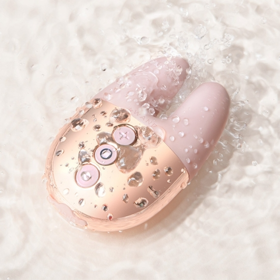 Rose gold rechargeable rabbit vibrator with water droplets.
