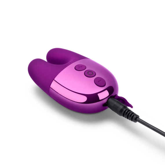 Purple rechargeable rabbit vibrator with charging cable attached.