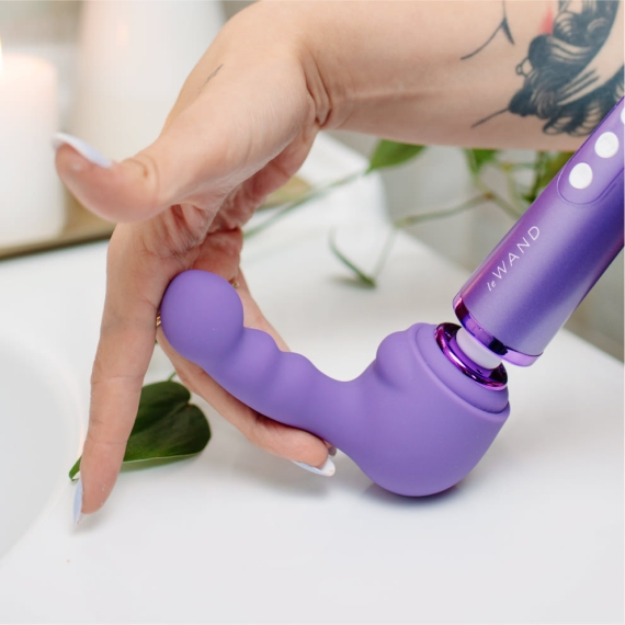 Purple silicone wand attachment with textured waves.