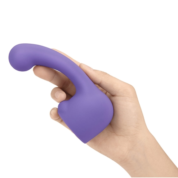 A purple silicone wand attachment with a curved head held in a hand.