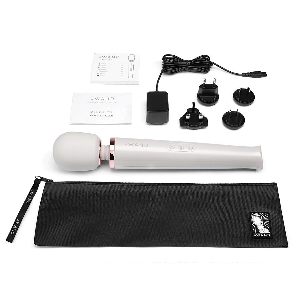 White rechargeable wand massager with accessories and storage pouch.