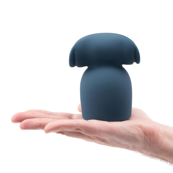 A blue silicone penis play wand attachment with textured ridges rests on a palm.