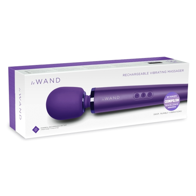 A purple Le Wand rechargeable vibrating massager in its box.