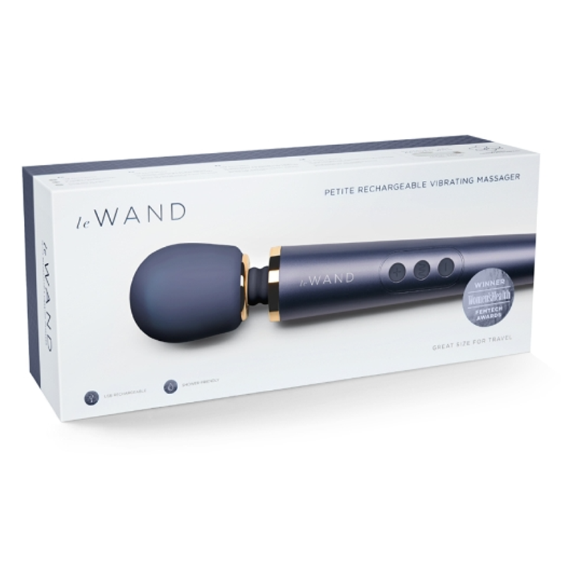 Navy silicone Le Wand petite rechargeable vibrating massager in its box.