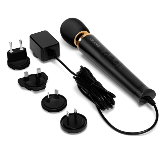 Black wand massager with power adapter and multiple plug attachments.
