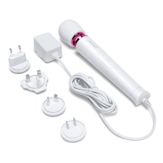 White wand massager with interchangeable plug adapters and charging cable.