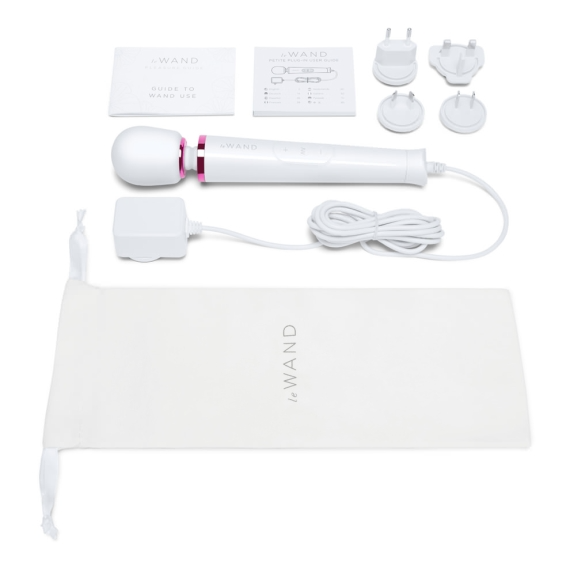White Le Wand petite plug-in wand massager with accessories and storage bag.