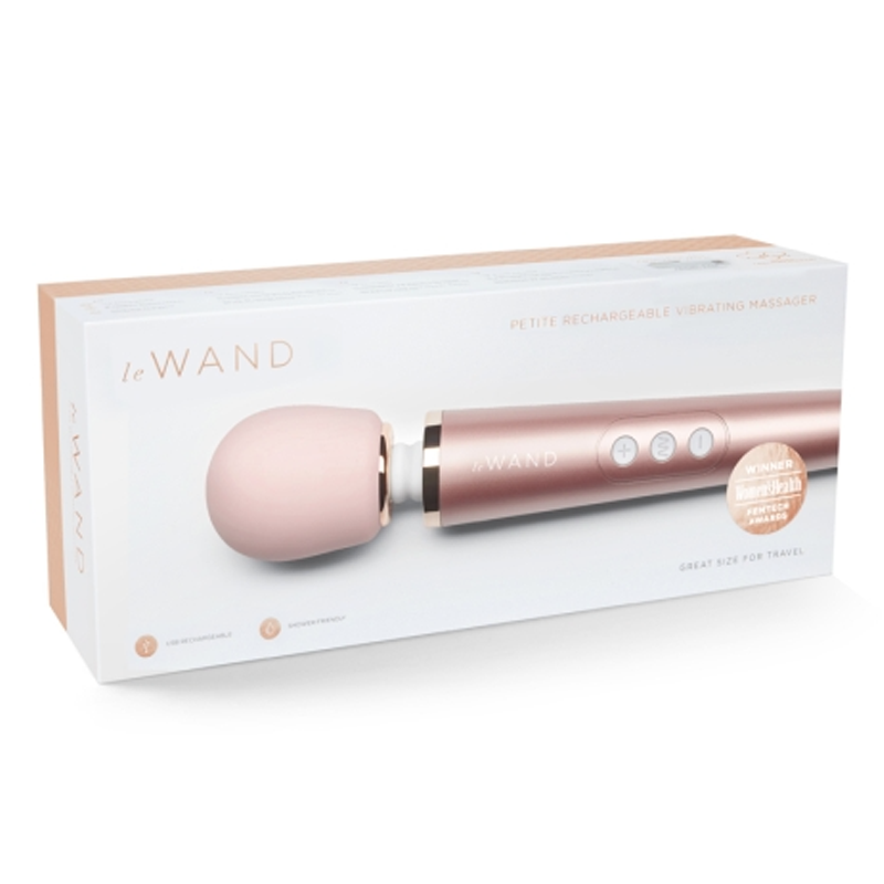 Rose gold Le Wand petite rechargeable vibrating massager in its box.