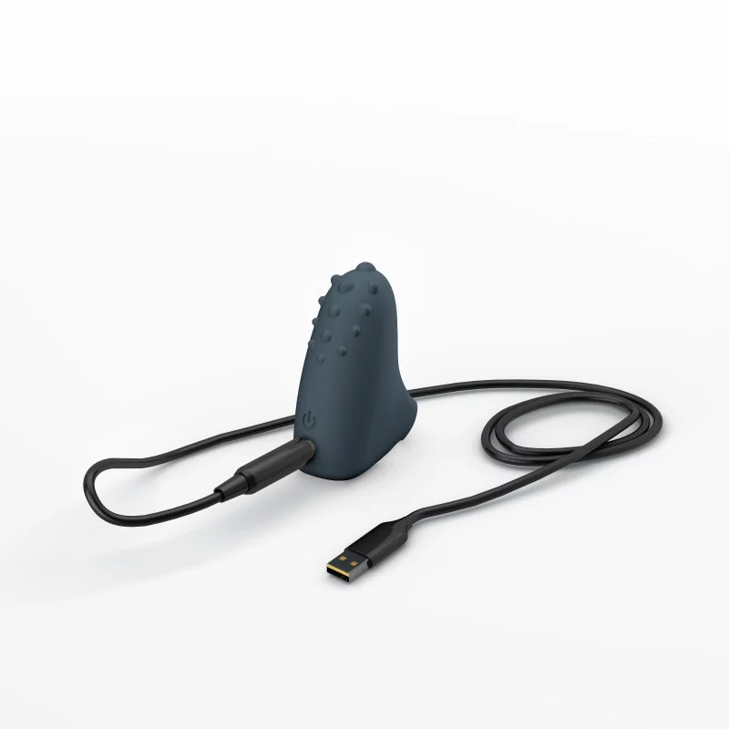 A dark blue silicone finger vibrator with a USB charging cable.