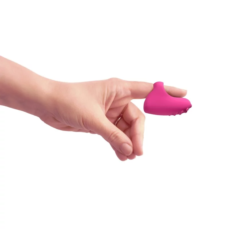 Pink silicone clitoral vibrator shaped like a foot on a finger.