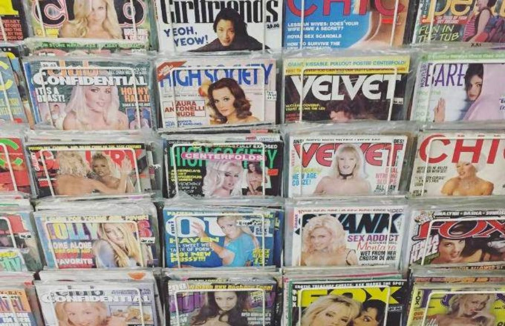 Assorted straight lifestyle magazines displayed on shelves with colorful covers.