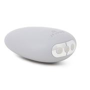 A light gray, pebble-shaped vibrator with three silver buttons and the Je Joue logo.