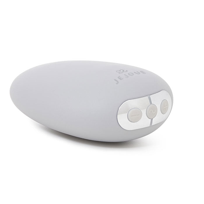 A light gray, pebble-shaped vibrator with three silver buttons and the Je Joue logo.