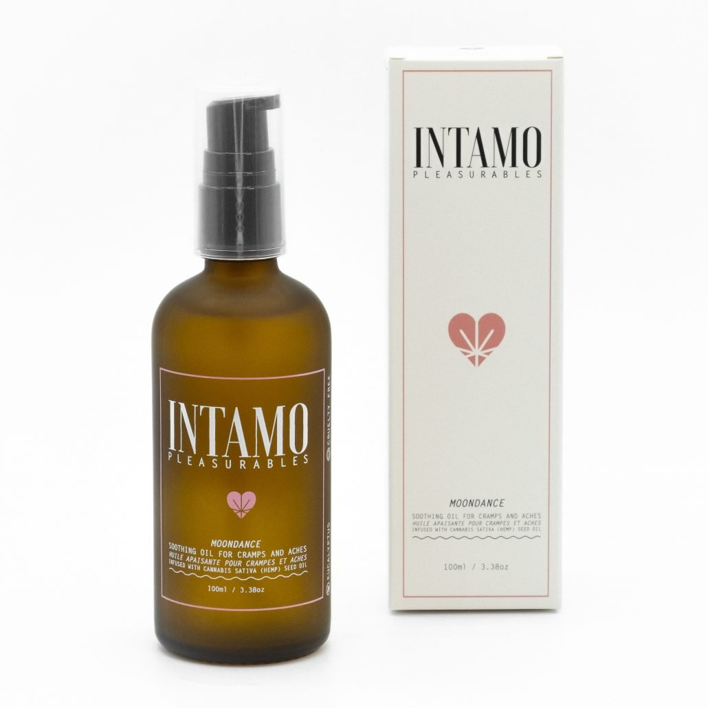 Intamo period pain relief oil in a brown bottle with a pump dispenser.