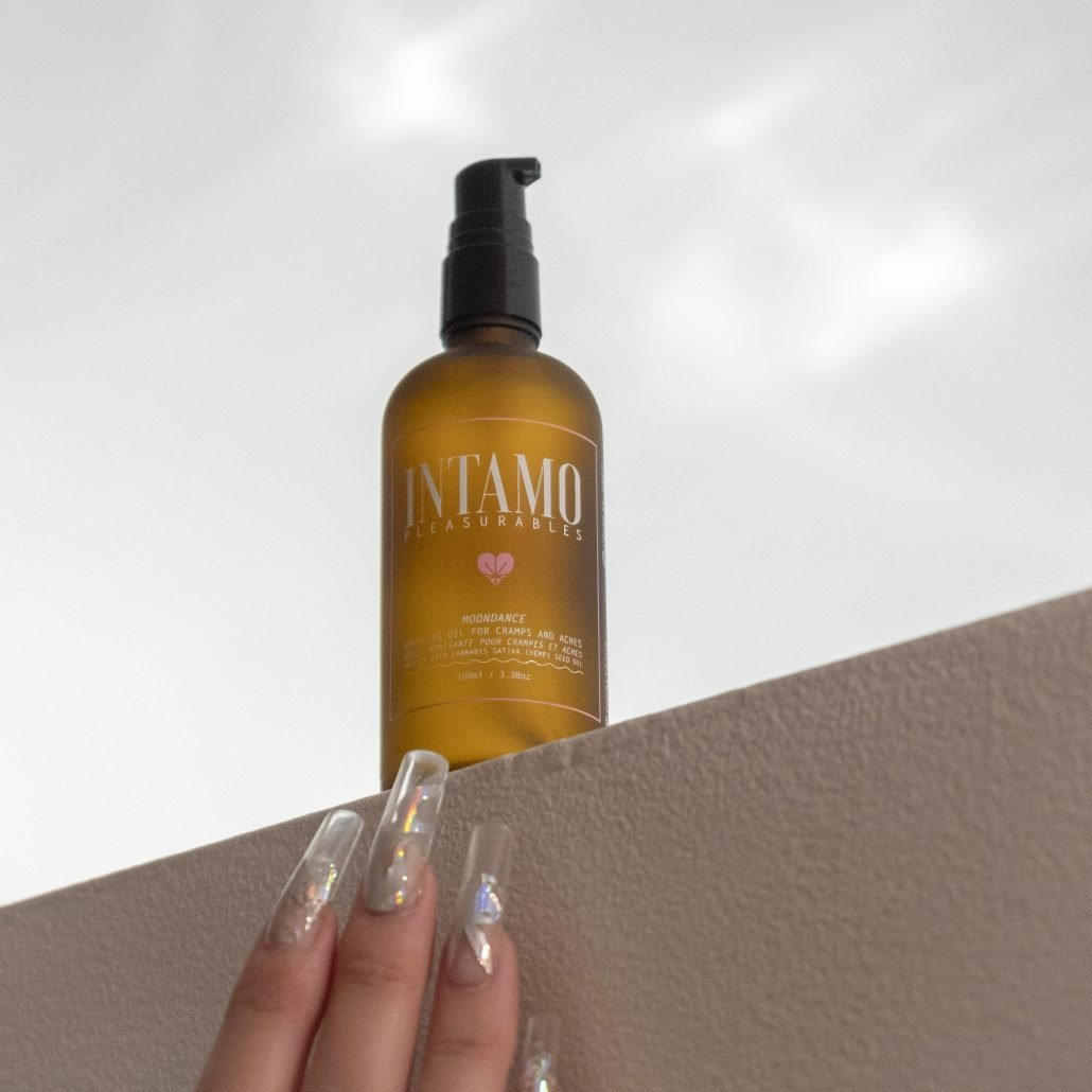A bottle of Intamo Moondance period pain relief oil with hemp and peppermint.