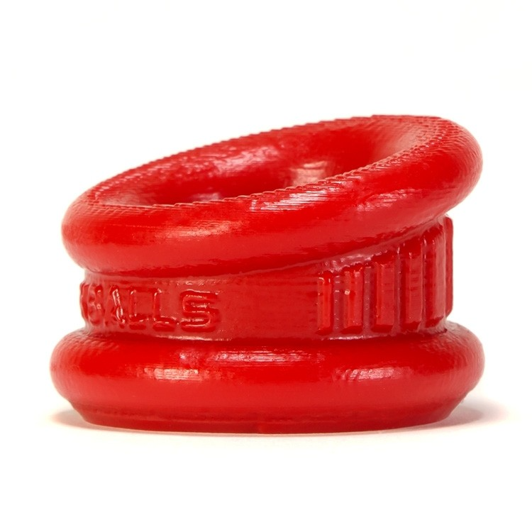 Red silicone ball stretcher with textured grip and angled opening.