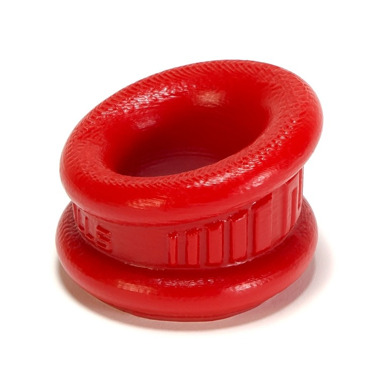 Red silicone neo angle ball stretcher and cock ring with textured rim.