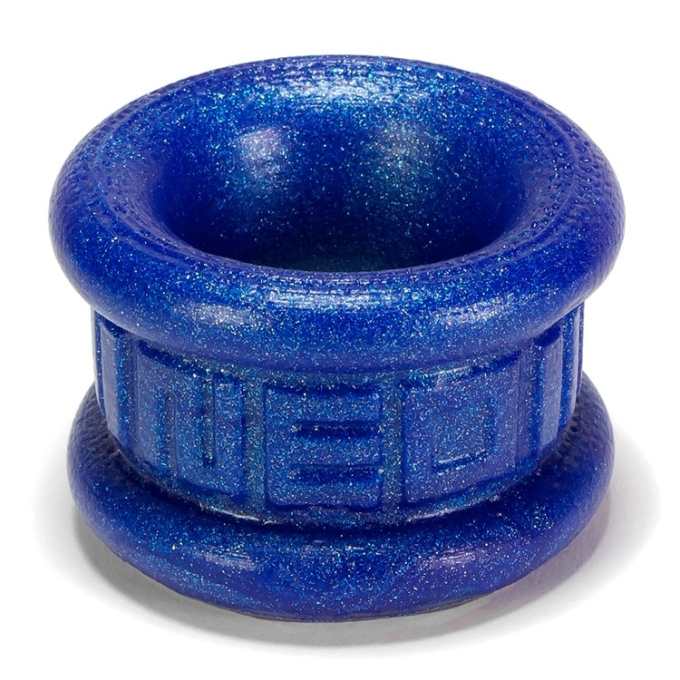 Blue metallic silicone ball stretcher with textured rim and embossed band.