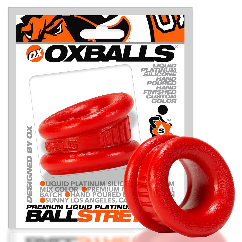 Red silicone ball stretcher and cock ring with "Oxballs" branding.