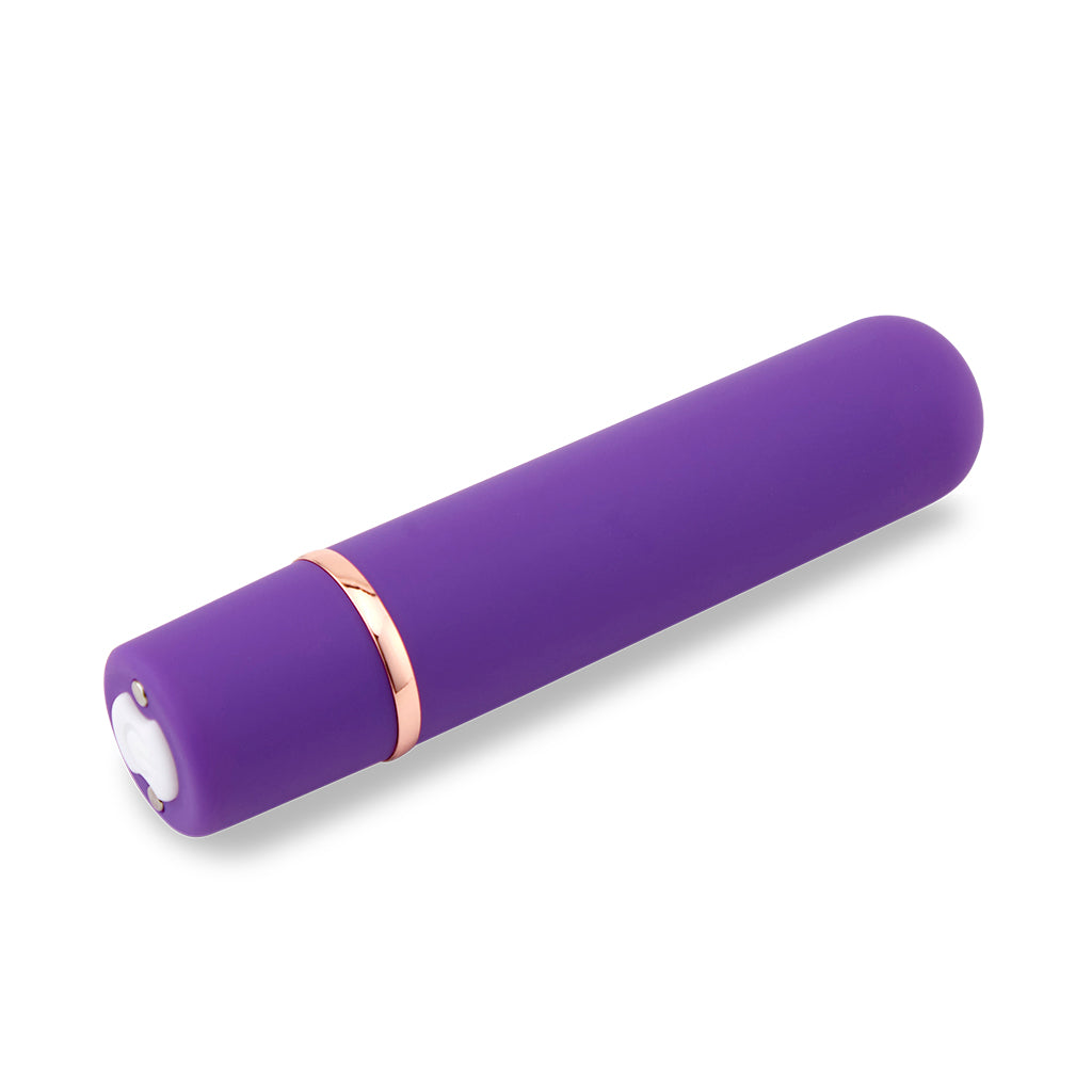 Purple rounded bullet vibrator with a rose gold band and white button.