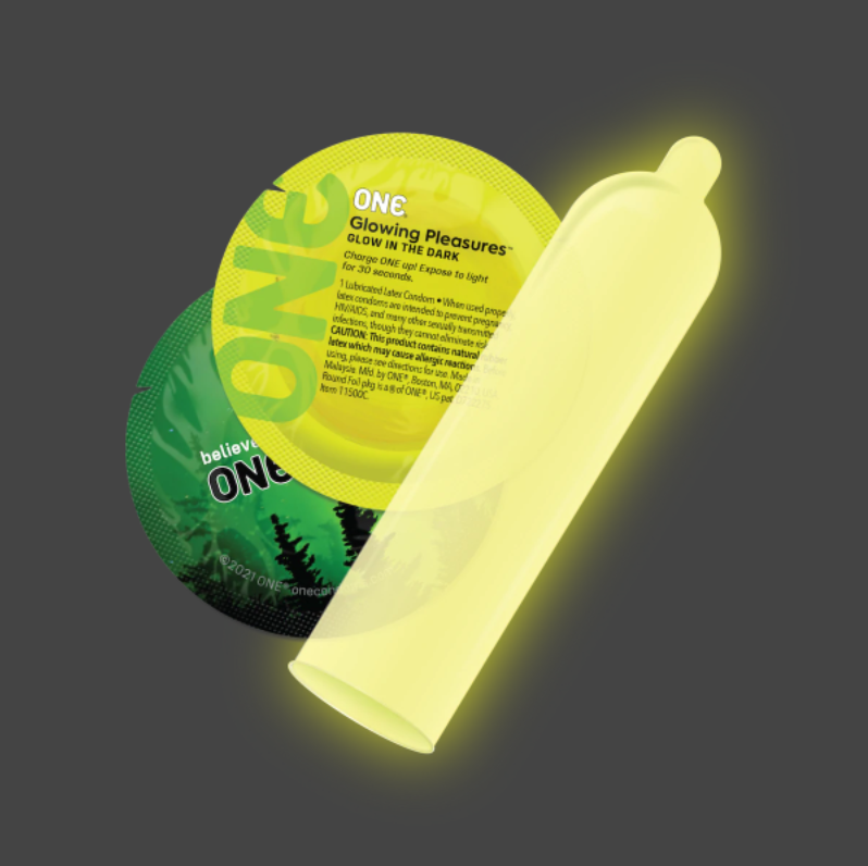 A glowing yellow condom with a circular package behind it.