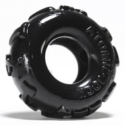 Black stretchy TPR cock ring with "ATOMIC JOCK" embossed on the side.