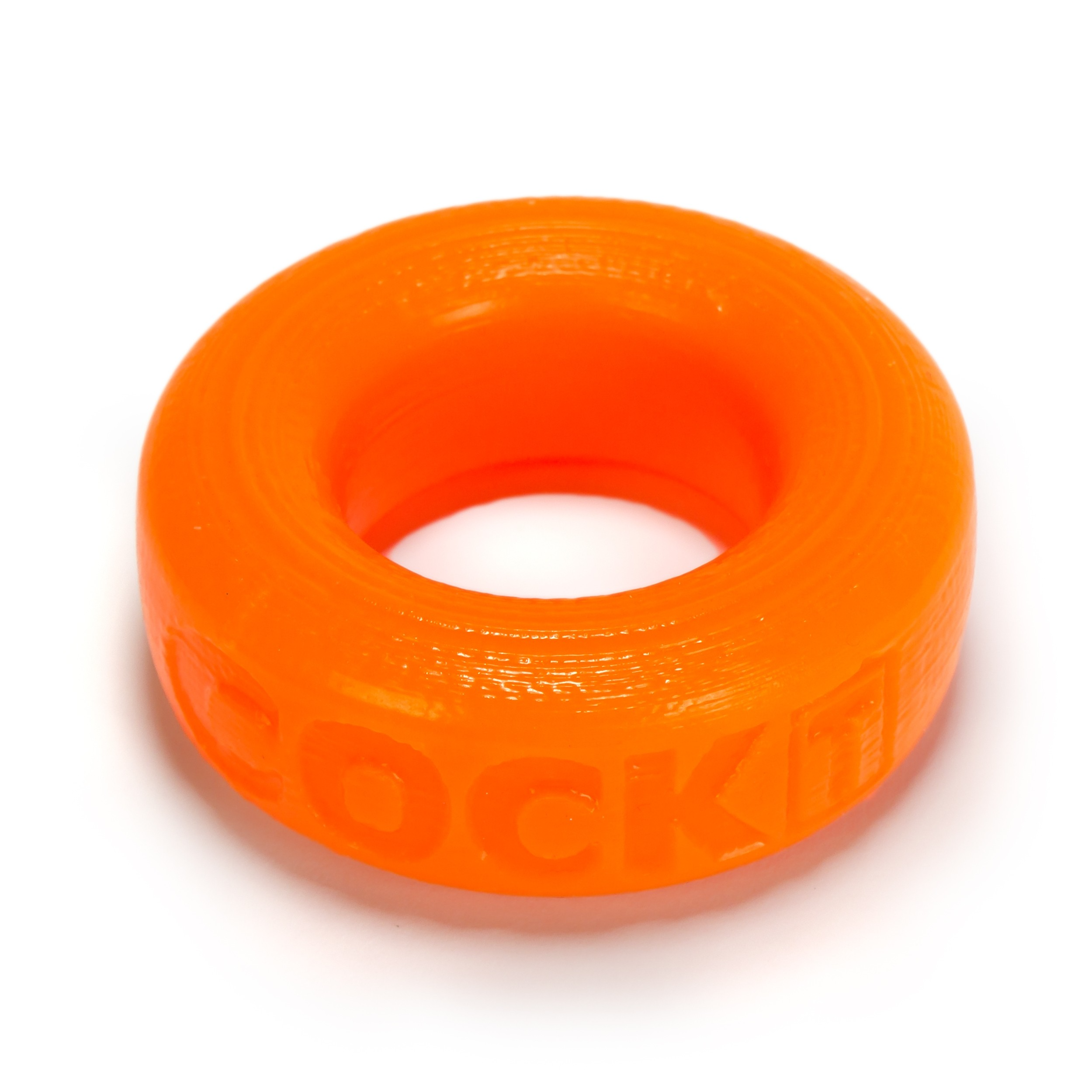 Orange silicone cock ring with embossed text.