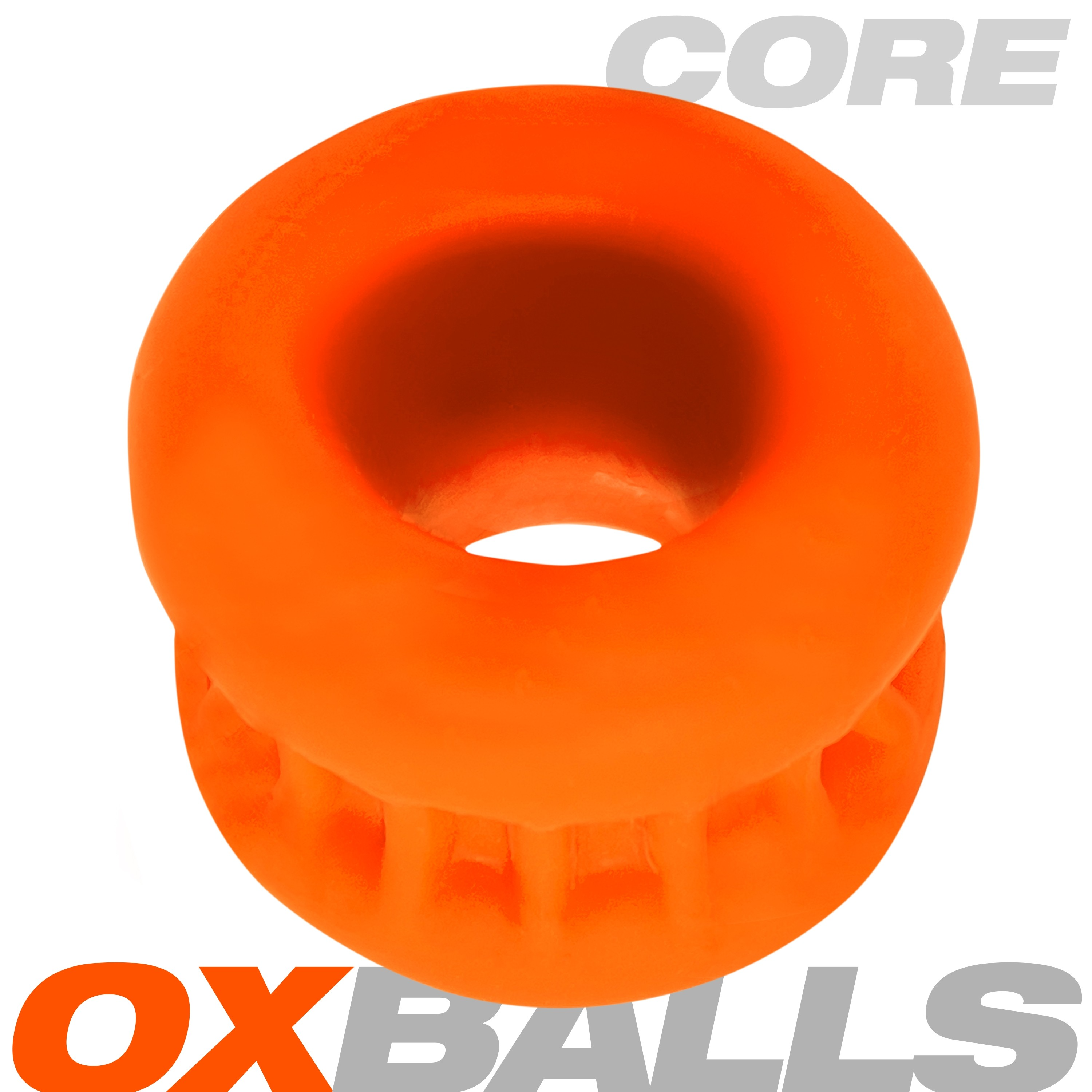 Orange silicone ball stretcher with ribbed grip and "CORE" and "OXBALLS" text.