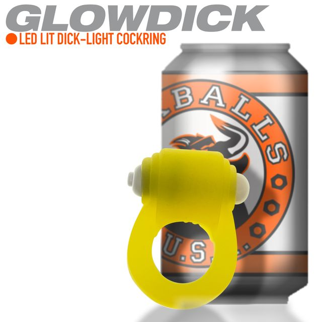 Yellow LED silicone cockring with a can in the background.