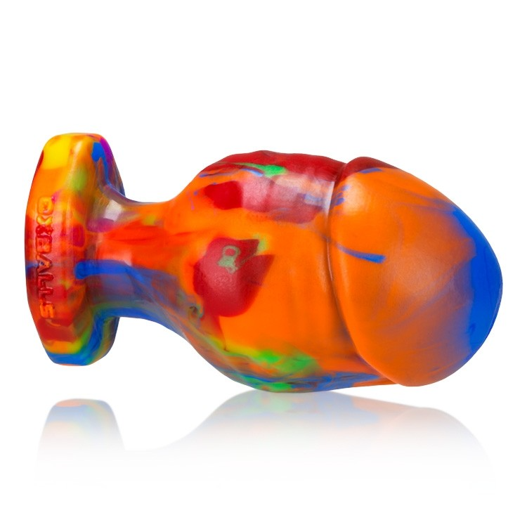 A small, rainbow-colored silicone anal plug with a textured surface.