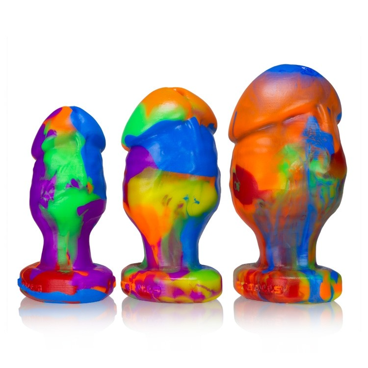 Three colorful silicone anal plugs of varying sizes.