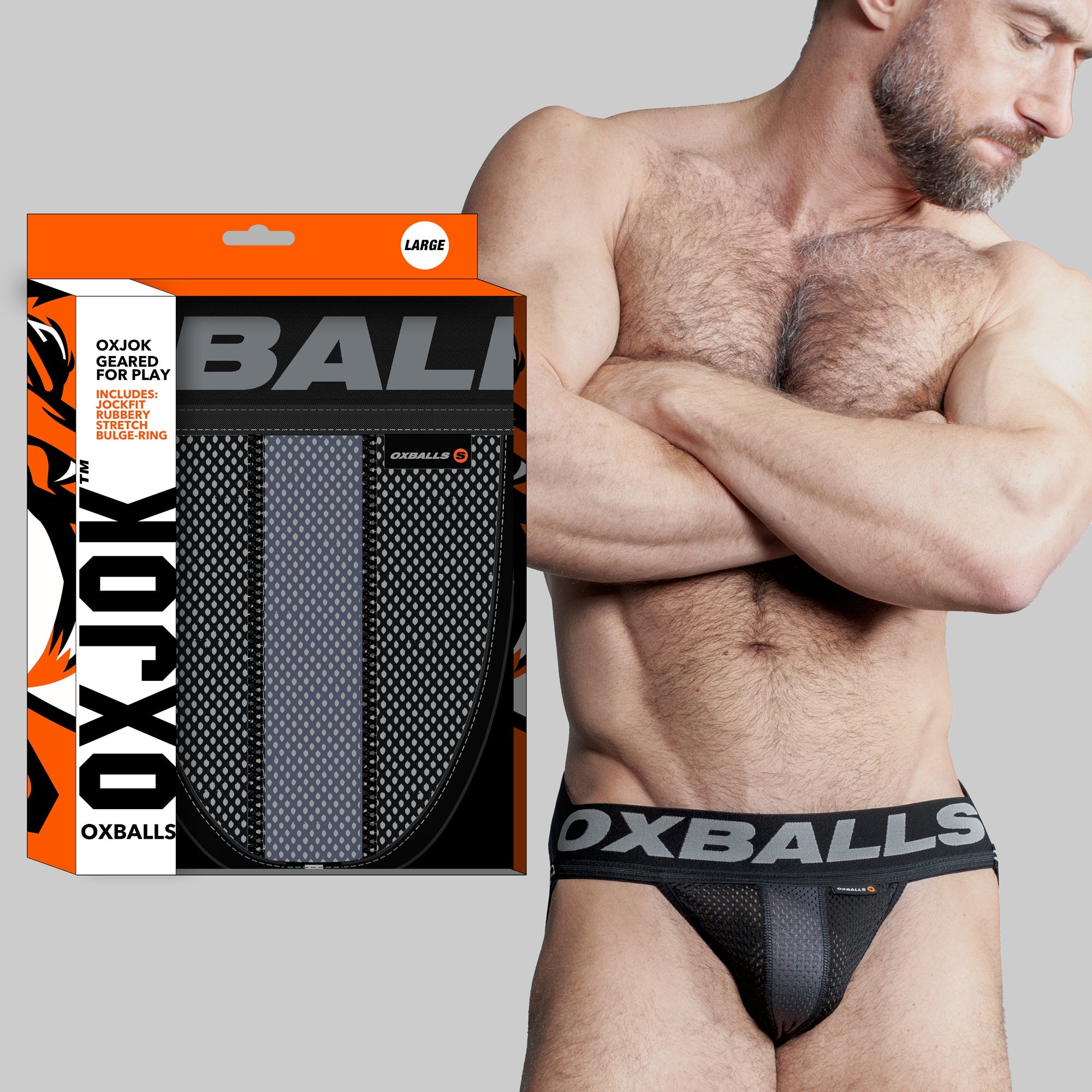 A black airmesh jockstrap with a cock ring and "OXBALLS" waistband.