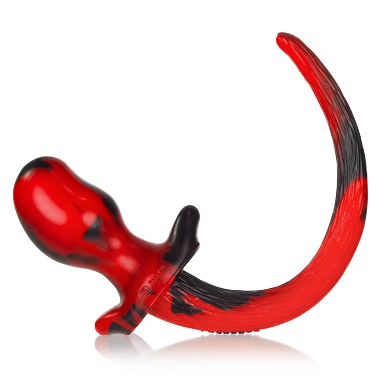 Red swirl silicone puppy tail anal plug with a kidney bean shaped base.