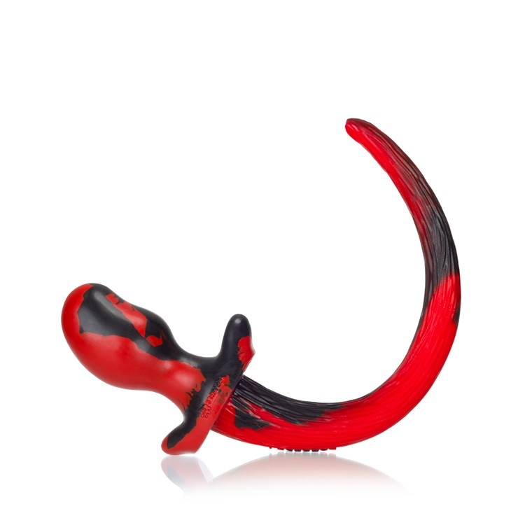 Red and black swirl silicone puppy tail anal plug.