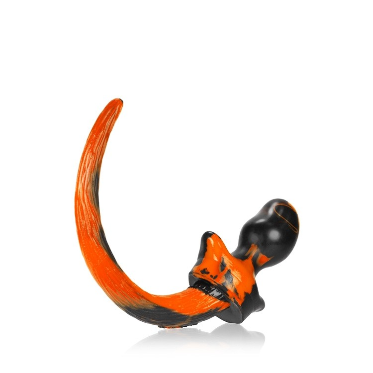 Orange and black swirl silicone puppy tail anal plug.