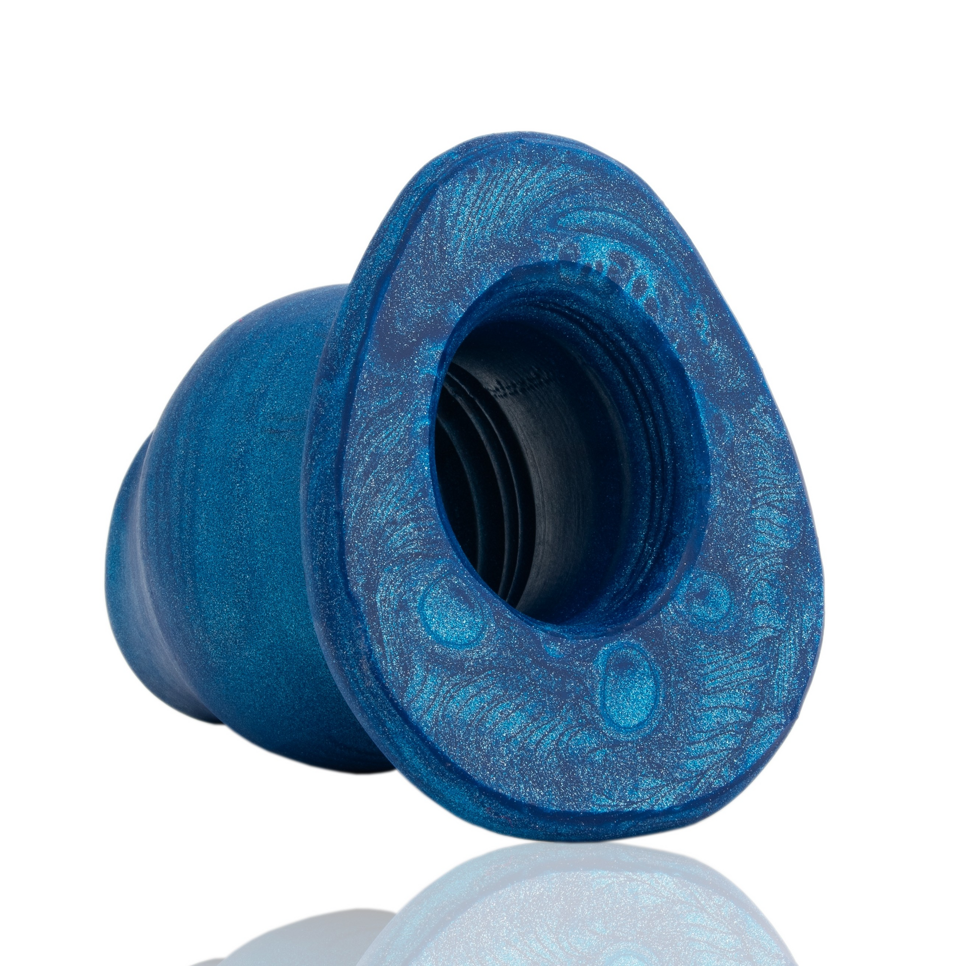 A blue, glittery, hollow silicone anal plug with a flared base.