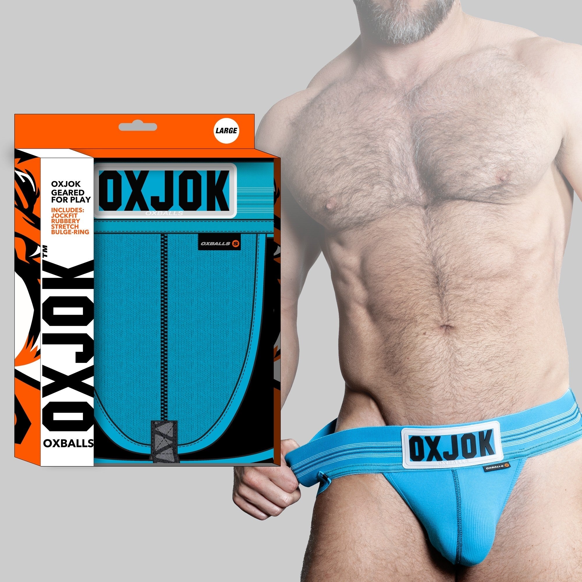 A blue Oxballs jockstrap with a white logo patch and a cock ring.