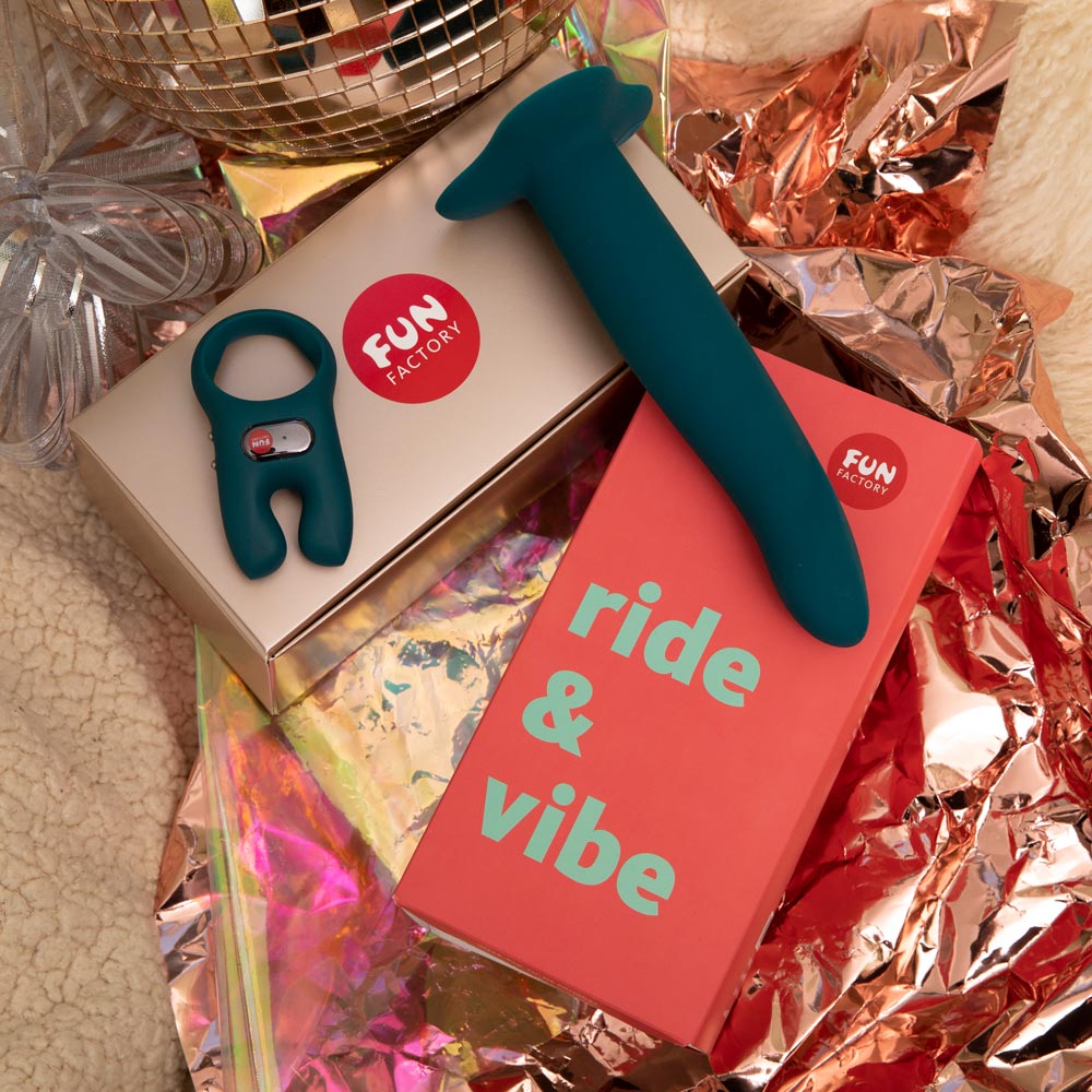A teal vibrator and ring sit on gift boxes with "fun factory" logos.