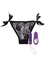 Purple remote-controlled vibrating panty with black lace and ribbon ties.
