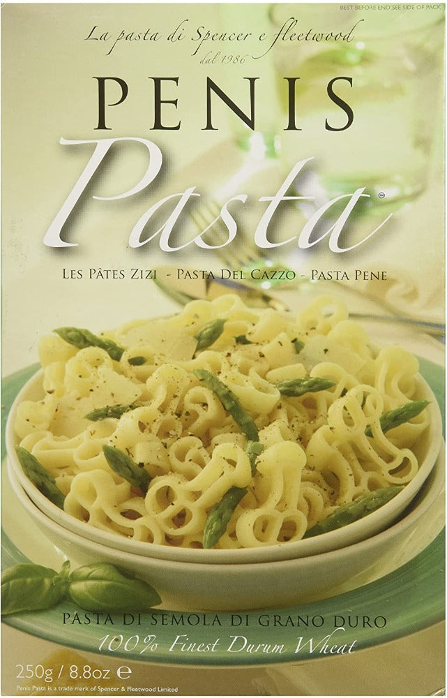 Pasta a forma di pene in una ciotola con asparagi.