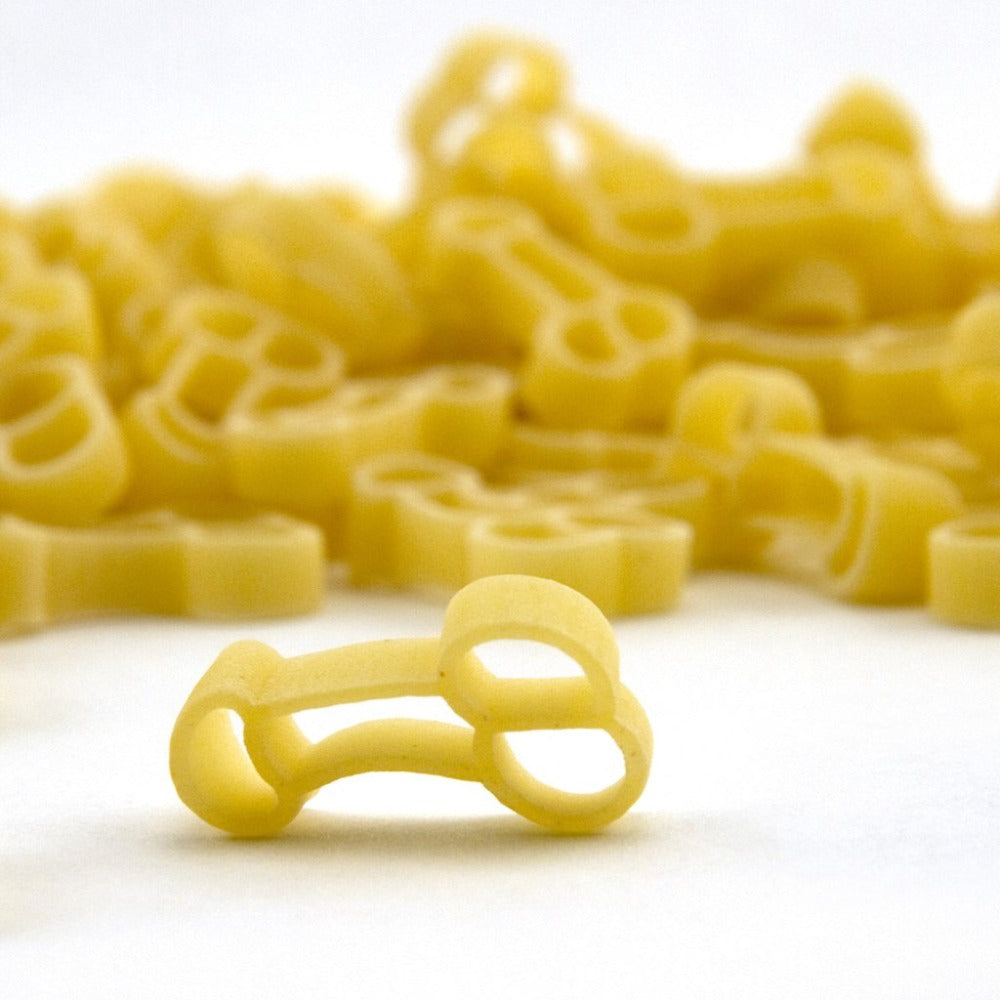 Penis-shaped pasta in a close-up studio shot.