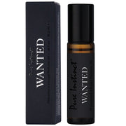 Pure Instinct Wanted Pheromone Perfume Oil for men in a rollerball bottle.