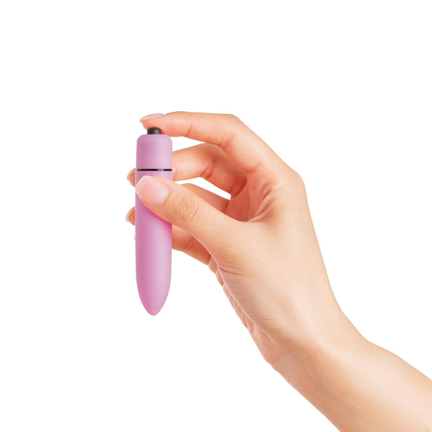 A hand holds a pink intimate groomer with a black button.